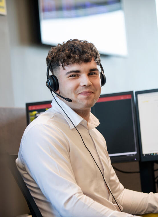 Male call centre operator wearing headset